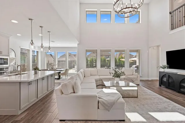 a living room with fireplace furniture and a flat screen tv