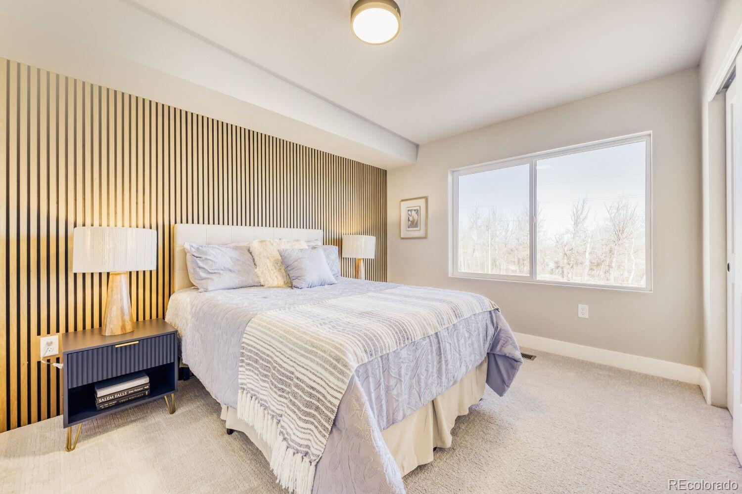9195 Pierce Street, Unit 7 Westminster, CO 80021 - Photo 14 of 25 a bedroom with a bed and a window