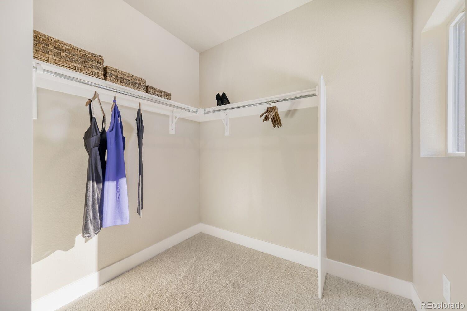 9195 Pierce Street, Unit 7 Westminster, CO 80021 - Photo 19 of 25 a view of walk in closet with clothes