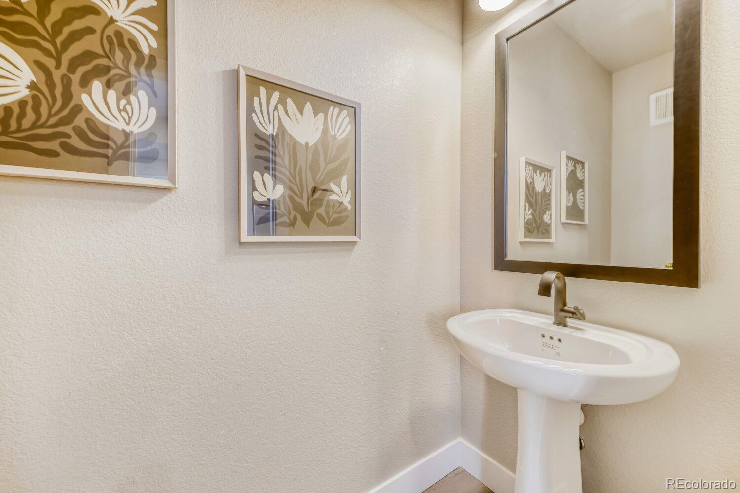 9195 Pierce Street, Unit 7 Westminster, CO 80021 - Photo 20 of 25 a bathroom with a sink and a mirror