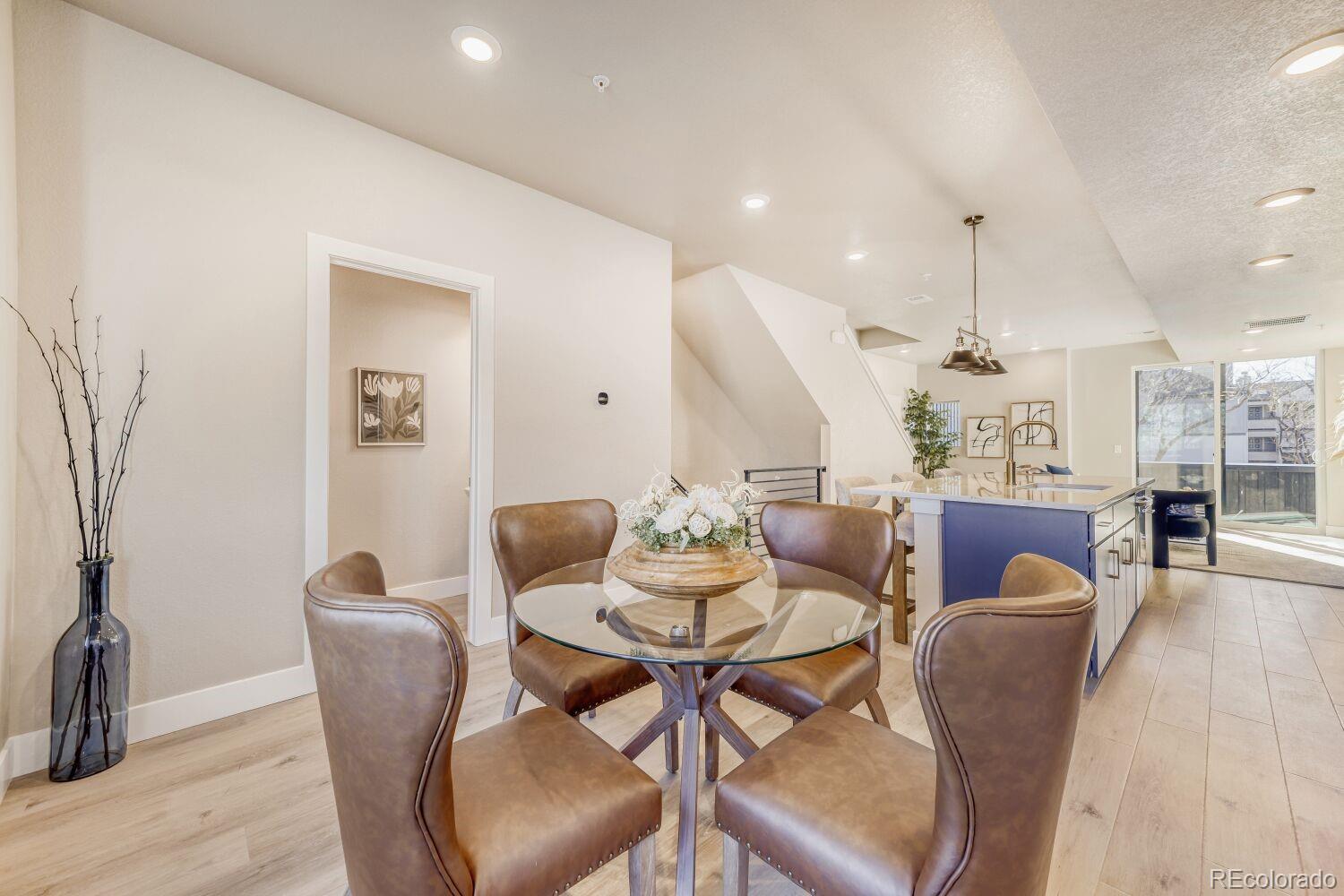 9195 Pierce Street, Unit 7 Westminster, CO 80021 - Photo 7 of 25 a view of a dining room with furniture and wooden floor