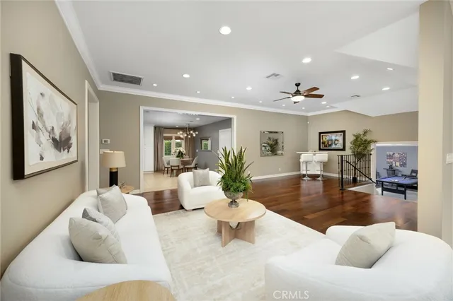a kitchen with refrigerator cabinets dining table and chairs