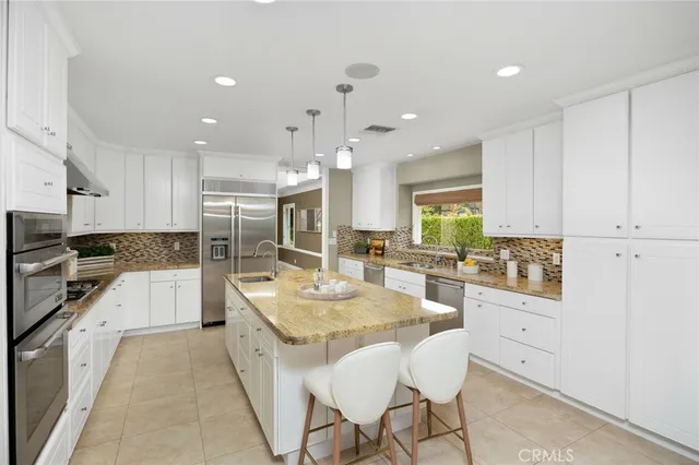a large bathroom with a tub shower and mirror