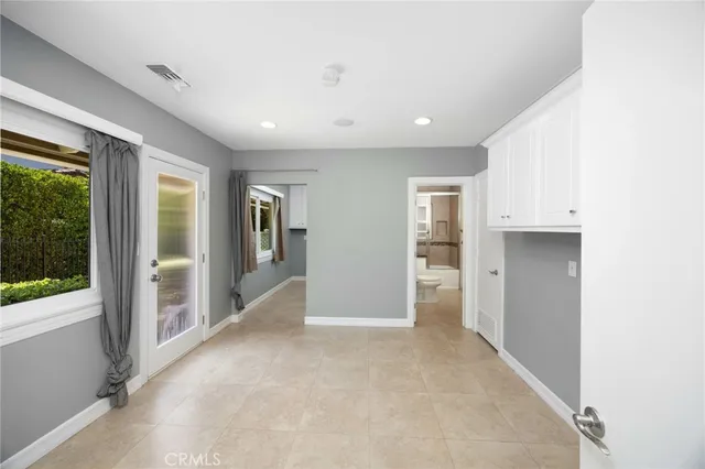 a view of a house with pool and chairs