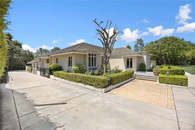 a living room with fireplace furniture and a wooden floor