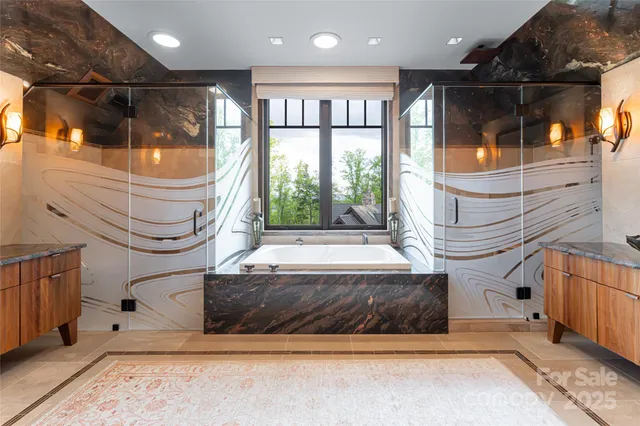 a bathroom with a bathtub and a shower