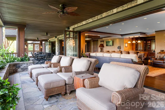 a view of a patio with a table chairs and backyard