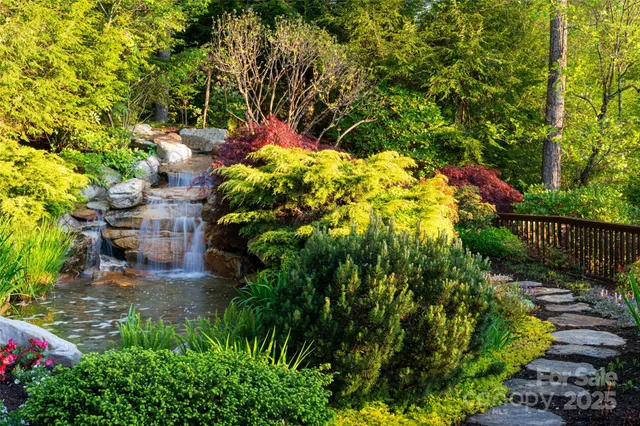 a backyard of a house with a yard and outdoor seating