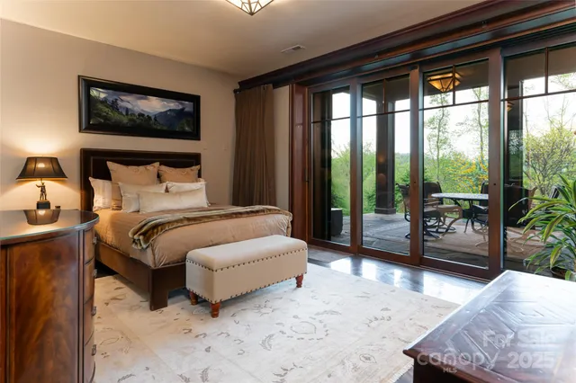 a bedroom with a large bed and a large window