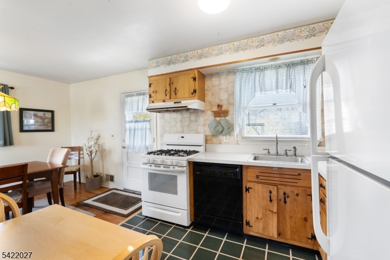 248 Perry Street Dover, NJ 07801 - Photo 13 of 24 a kitchen with a sink stove and cabinets