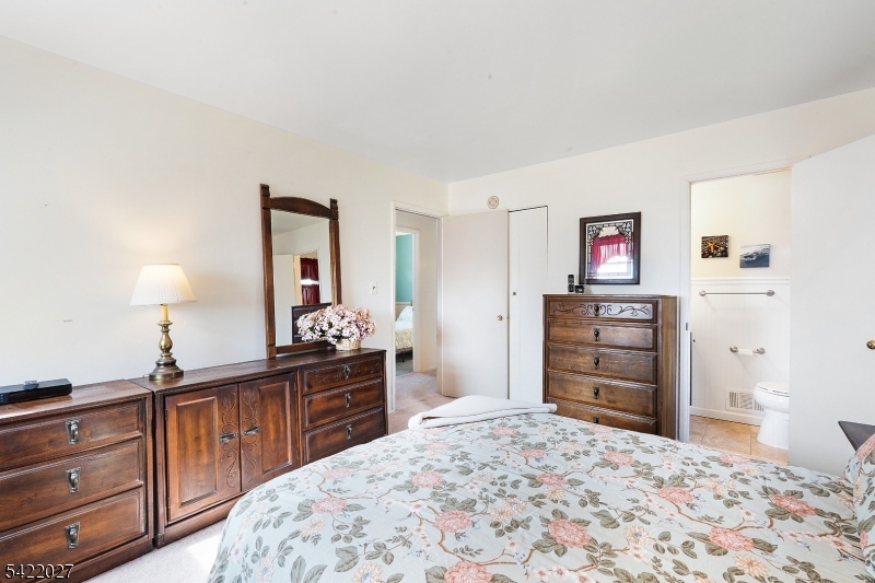 248 Perry Street Dover, NJ 07801 - Photo 16 of 24 a bedroom with a bed and a dresser