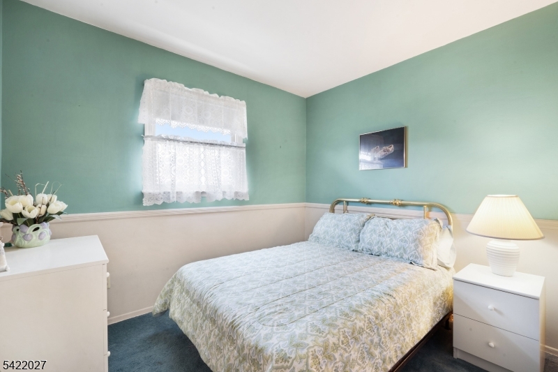 248 Perry Street Dover, NJ 07801 - Photo 18 of 24 a bedroom with a bed and window