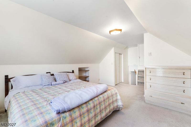 248 Perry Street Dover, NJ 07801 - Photo 21 of 24 a bedroom with a bed and a dresser