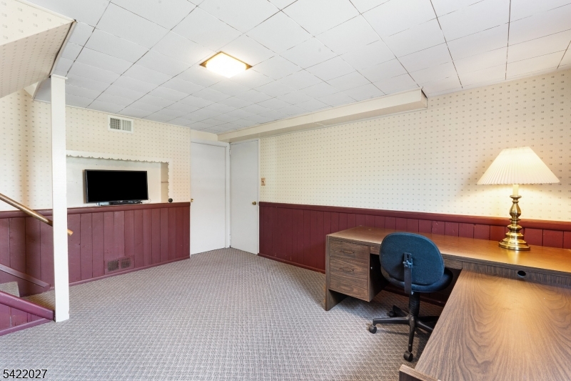 248 Perry Street Dover, NJ 07801 - Photo 22 of 24 a living room with furniture and a flat screen tv