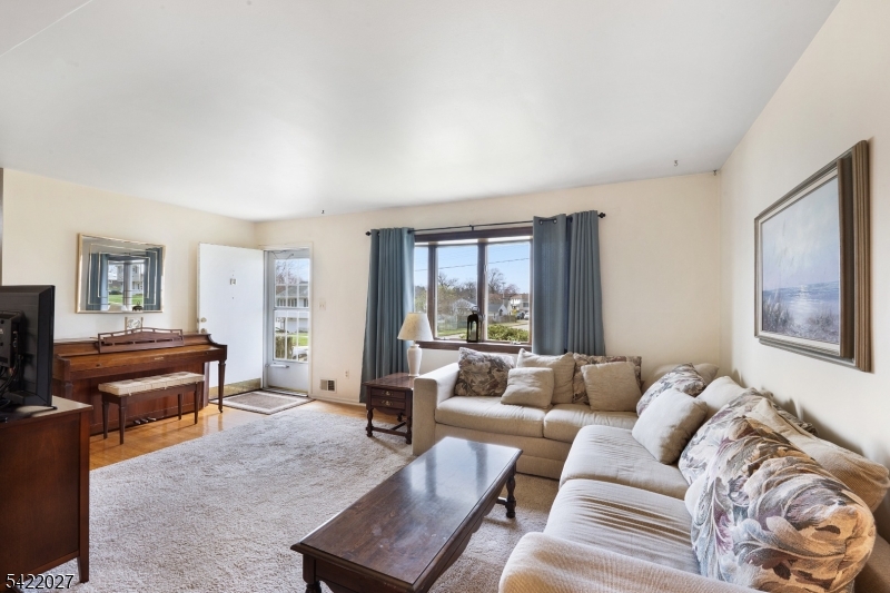 248 Perry Street Dover, NJ 07801 - Photo 5 of 24 a living room with furniture and a window
