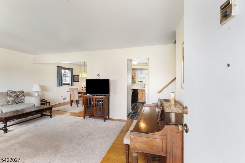 248 Perry Street Dover, NJ 07801 - Photo 6 of 24 a room with furniture and a flat screen tv