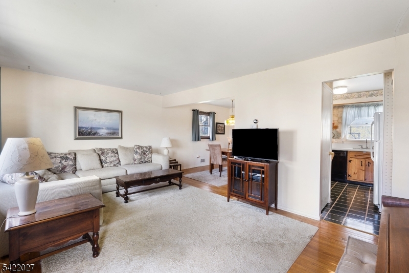 248 Perry Street Dover, NJ 07801 - Photo 7 of 24 a living room with furniture and a flat screen tv