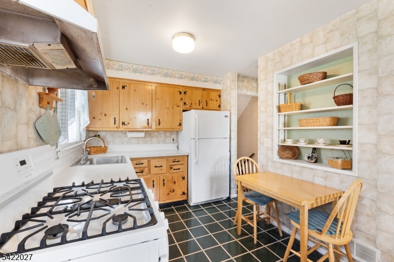 248 Perry Street Dover, NJ 07801 - Photo 10 of 24 a kitchen with stainless steel appliances a stove a sink and a refrigerator
