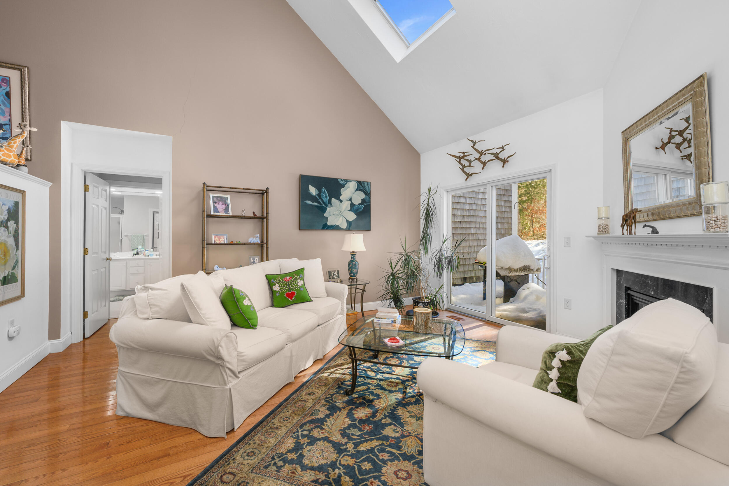 22 Stratford Ridge, Unit 22 Mashpee, MA 02649 - Photo 11 of 38 a living room with furniture and a fireplace