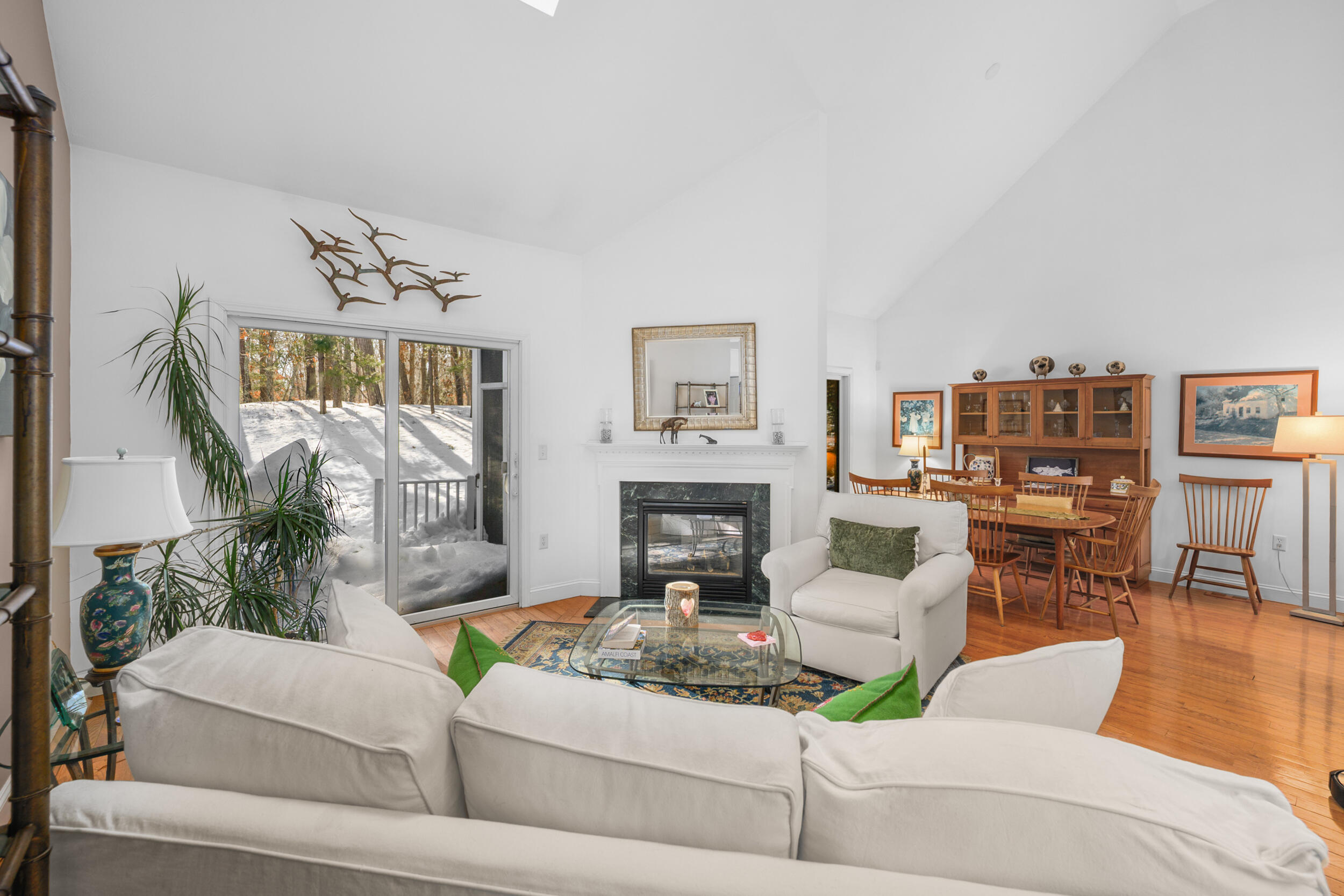 22 Stratford Ridge, Unit 22 Mashpee, MA 02649 - Photo 12 of 38 a living room with furniture and a fireplace