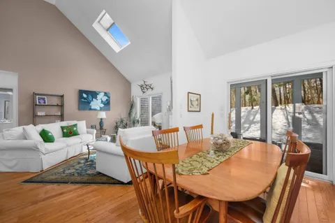 a view of a dining room with furniture wooden floor and a rug