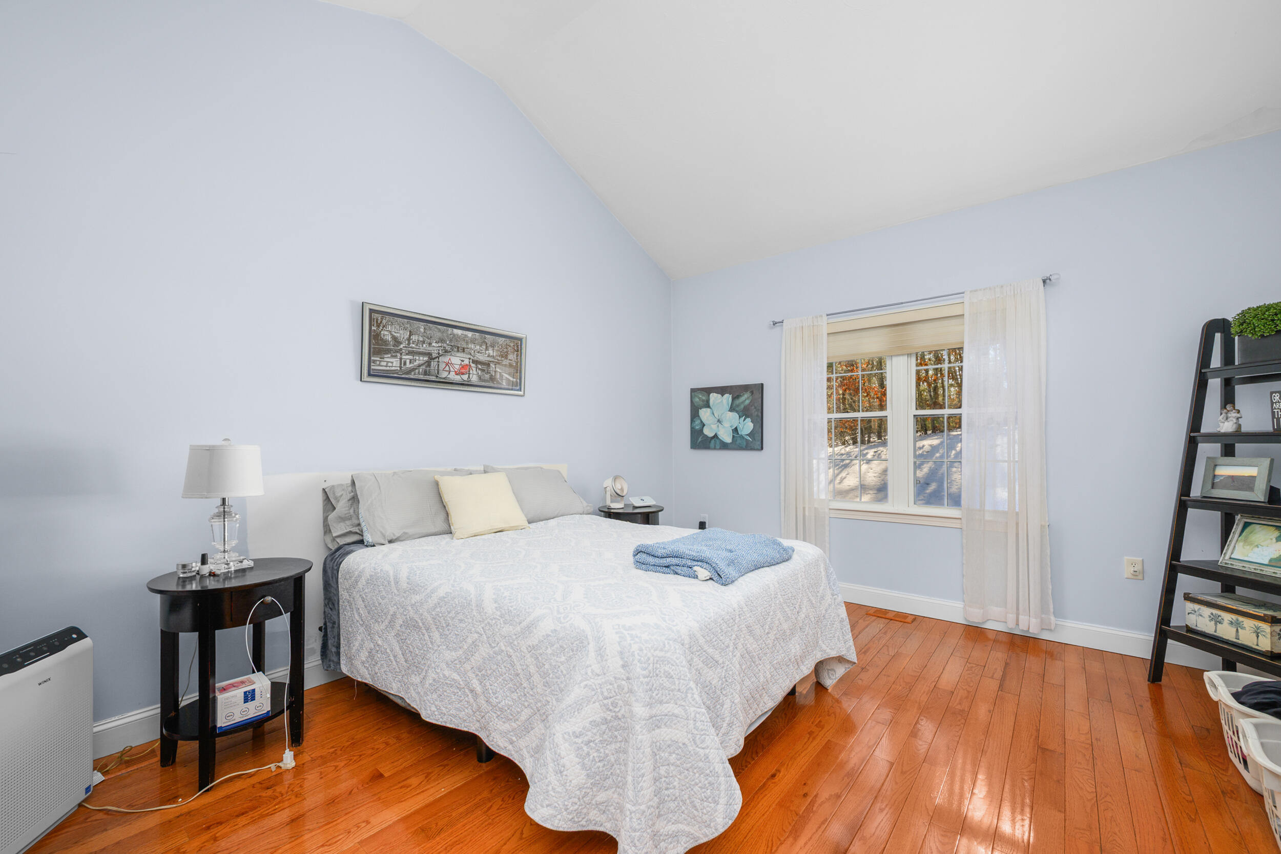 22 Stratford Ridge, Unit 22 Mashpee, MA 02649 - Photo 17 of 38 a bedroom with a bed and a book shelf
