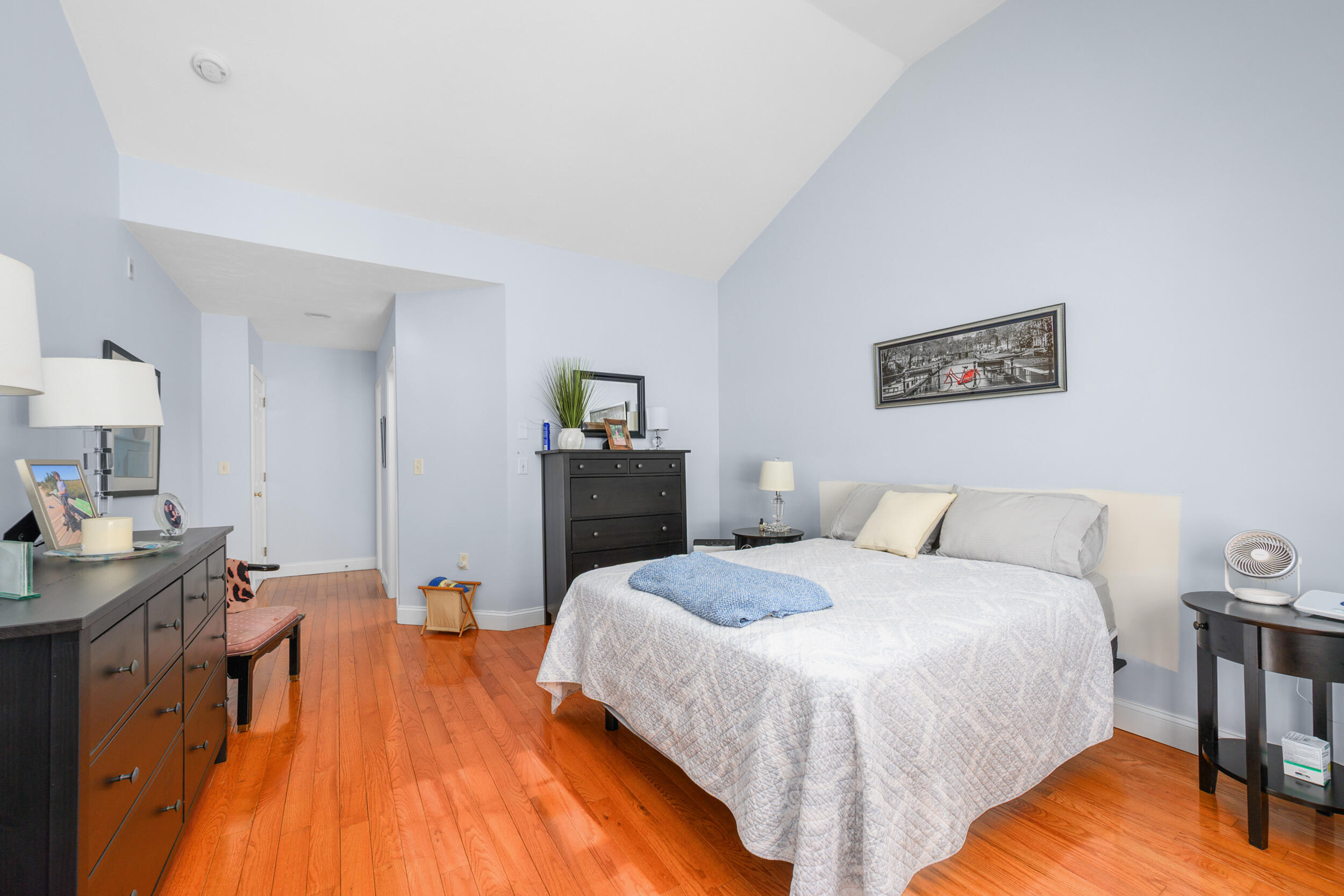 22 Stratford Ridge, Unit 22 Mashpee, MA 02649 - Photo 18 of 38 a spacious bedroom with a bed and a table in it