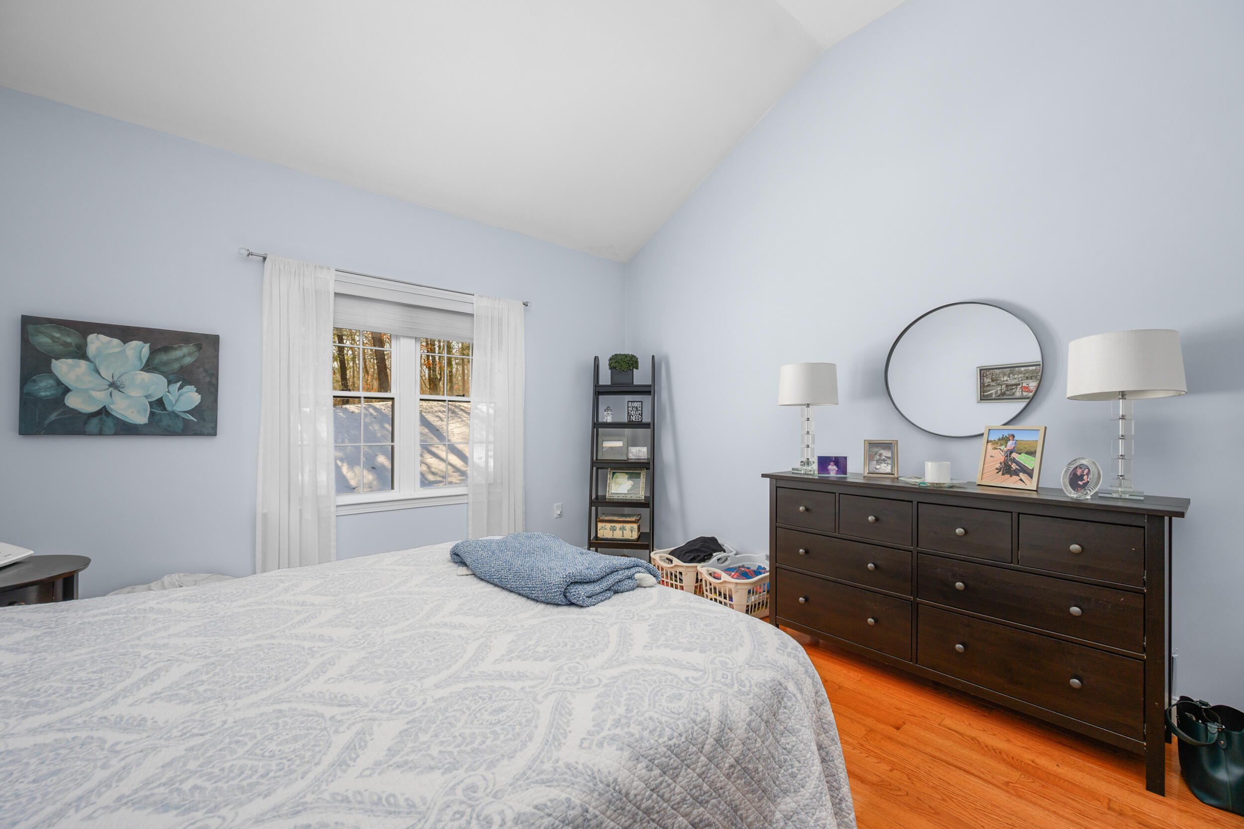 22 Stratford Ridge, Unit 22 Mashpee, MA 02649 - Photo 19 of 38 a bedroom with a bed and a dresser