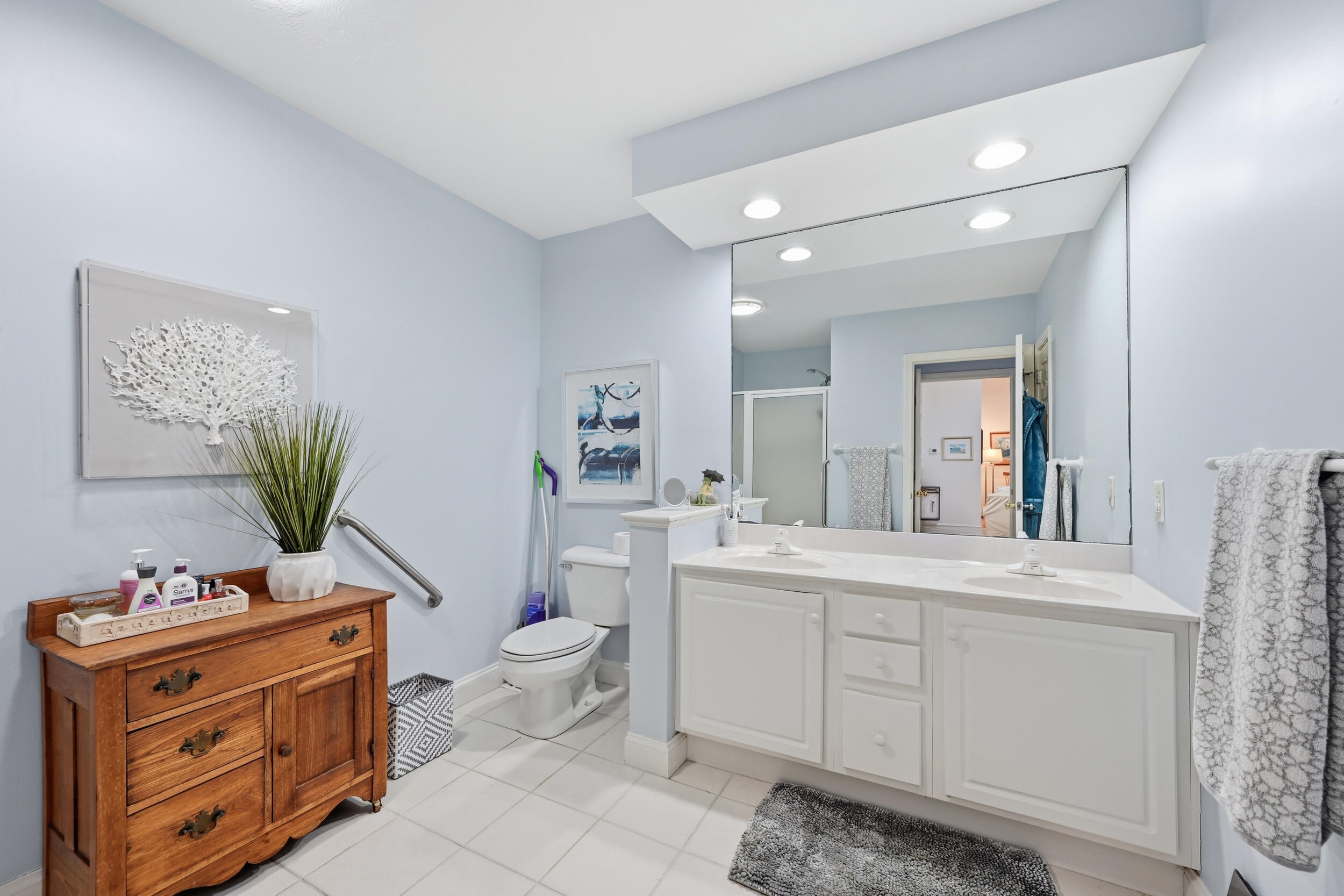 22 Stratford Ridge, Unit 22 Mashpee, MA 02649 - Photo 20 of 38 a spacious bathroom with a granite countertop toilet sink and mirror