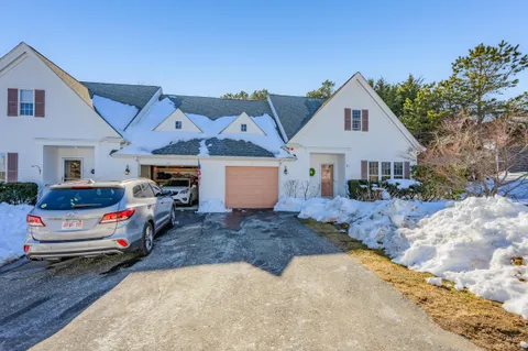 a view of front a house with a garage