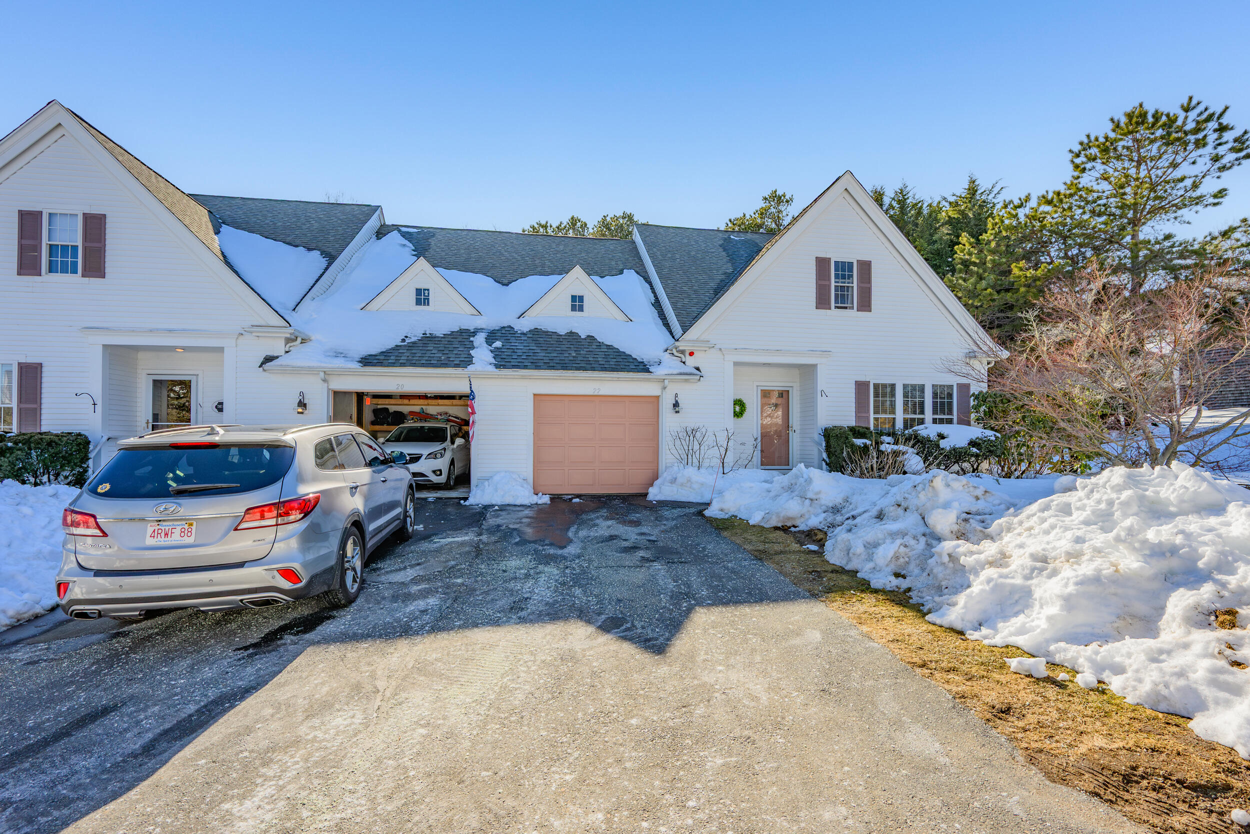 22 Stratford Ridge, Unit 22 Mashpee, MA 02649 - Photo 2 of 38 a view of front a house with a garage