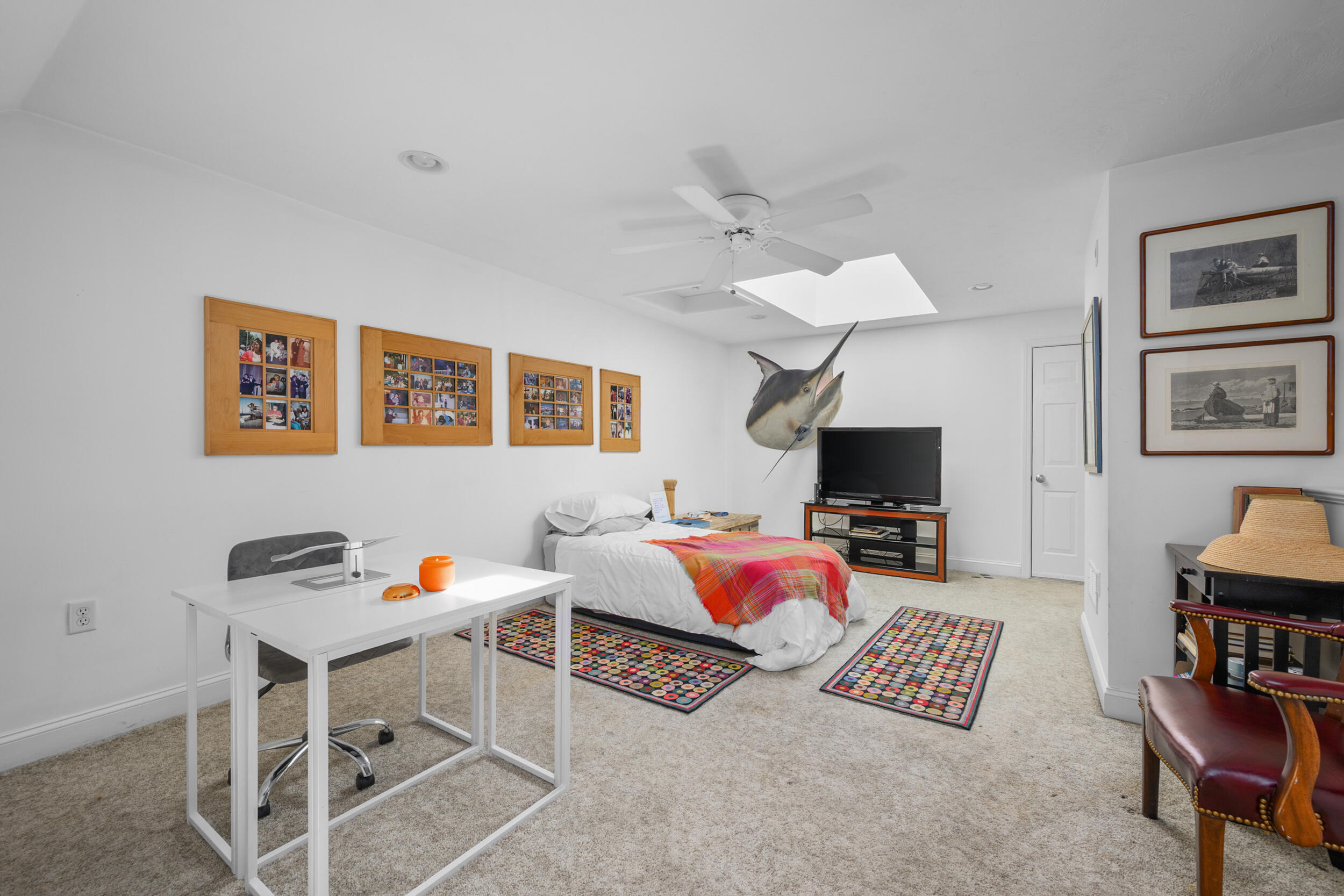22 Stratford Ridge, Unit 22 Mashpee, MA 02649 - Photo 26 of 38 a living room with furniture and a flat screen tv