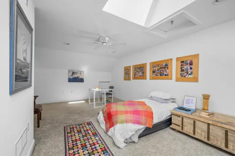 a bedroom with furniture and a window