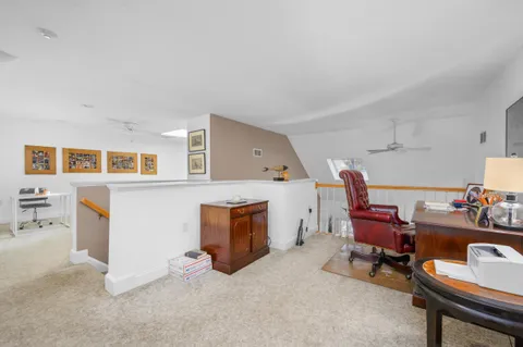 a spacious bedroom with a bed and a couch