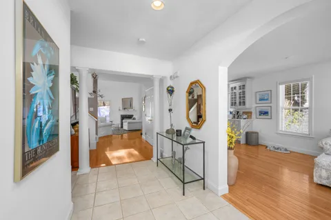a living room with furniture and a clock