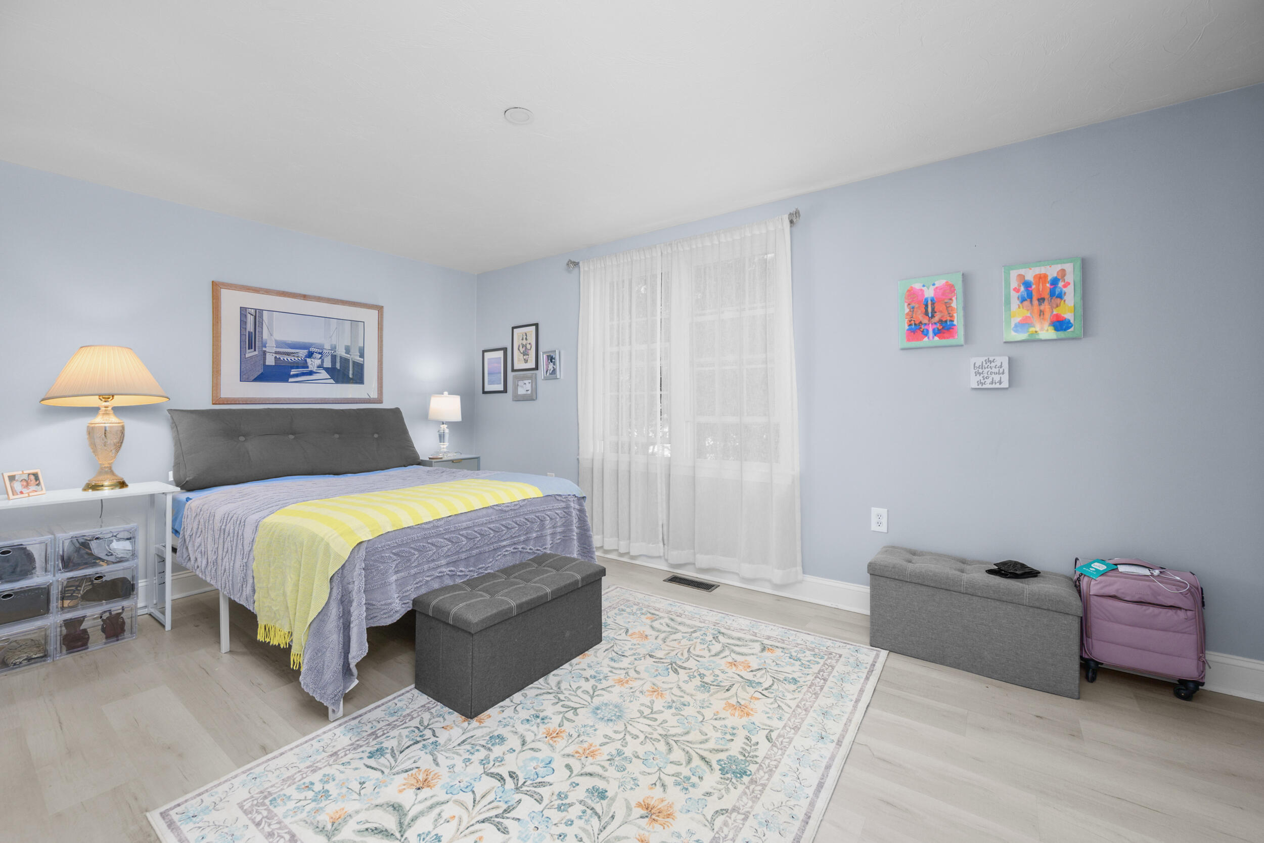 22 Stratford Ridge, Unit 22 Mashpee, MA 02649 - Photo 31 of 38 a spacious bedroom with a bed and a couch