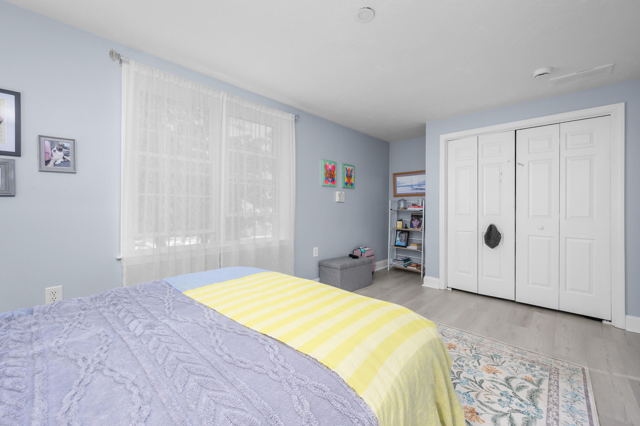 22 Stratford Ridge, Unit 22 Mashpee, MA 02649 - Photo 32 of 38 a spacious bedroom with a bed and a window