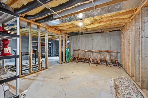 a view of empty room with wooden walls
