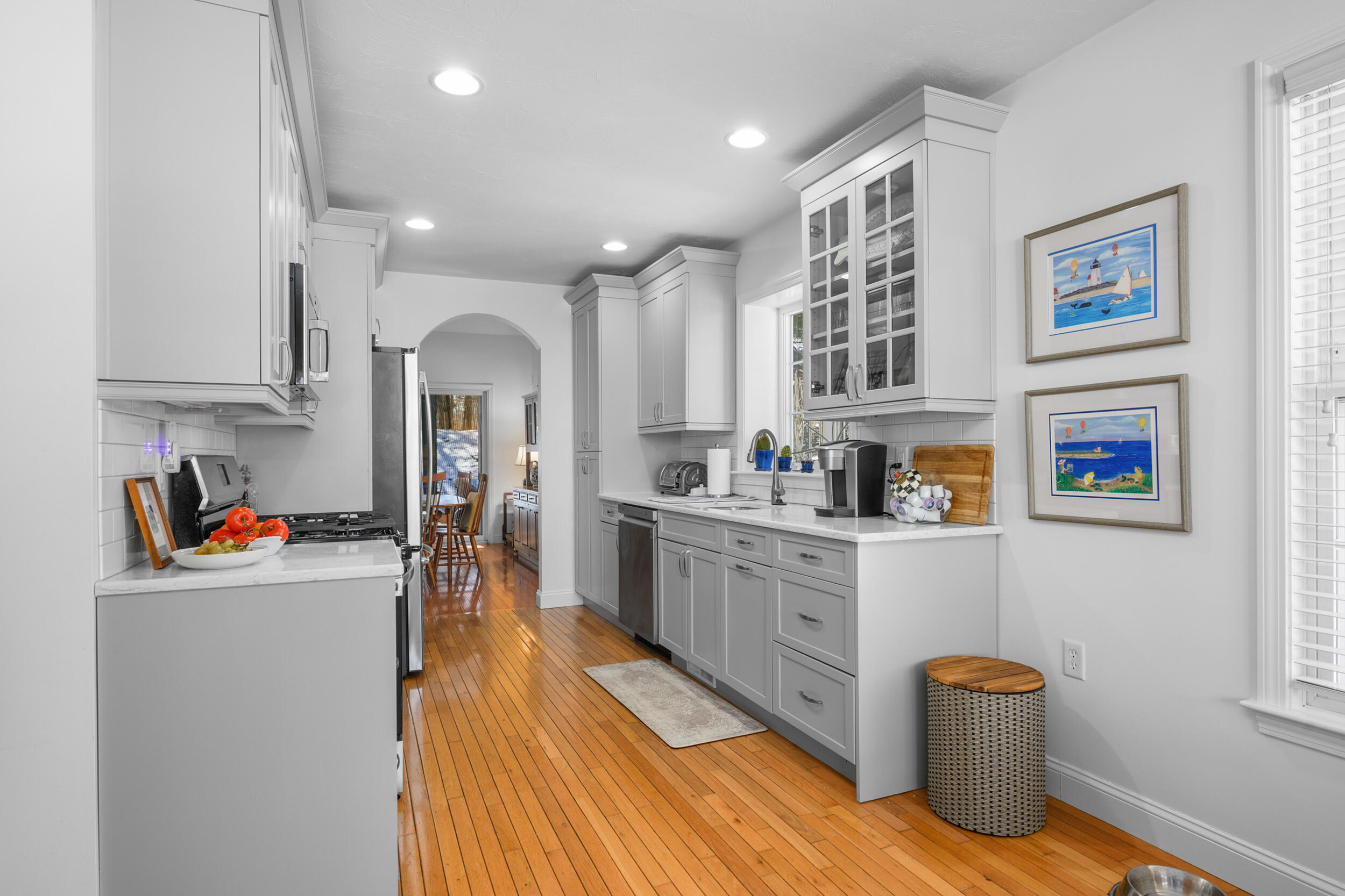 22 Stratford Ridge, Unit 22 Mashpee, MA 02649 - Photo 5 of 38 a kitchen with stainless steel appliances granite countertop a refrigerator and a sink