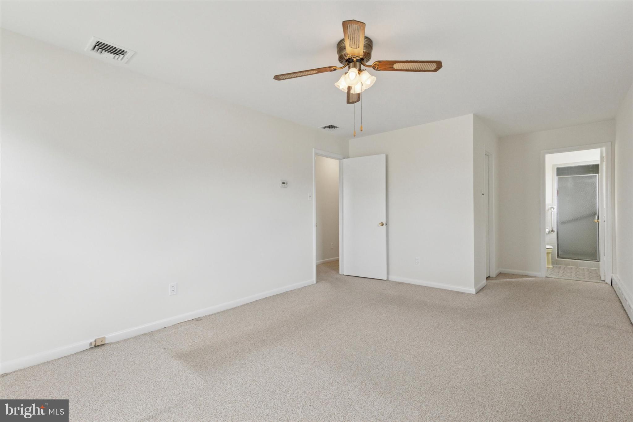 2008 Hemlock Road Jeffersonville, PA 19403 - Photo 22 of 32 an empty room with a chandelier fan and a chandelier fan