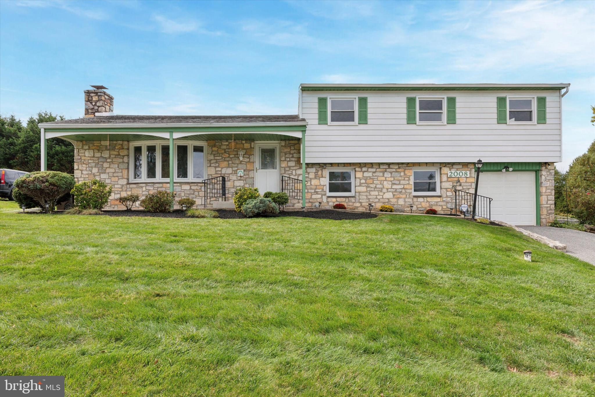 2008 Hemlock Road Jeffersonville, PA 19403 - Photo 29 of 32 a front view of house with yard and green space