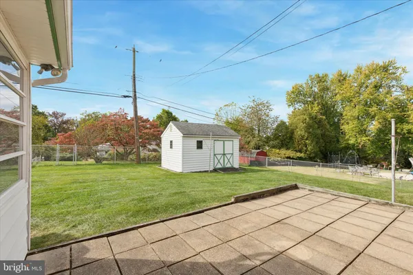 a house view with a play ground in front of it