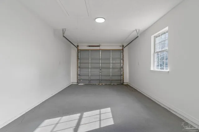a view of a livingroom with wooden floor and window