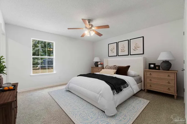 a bed room with a bed and a window