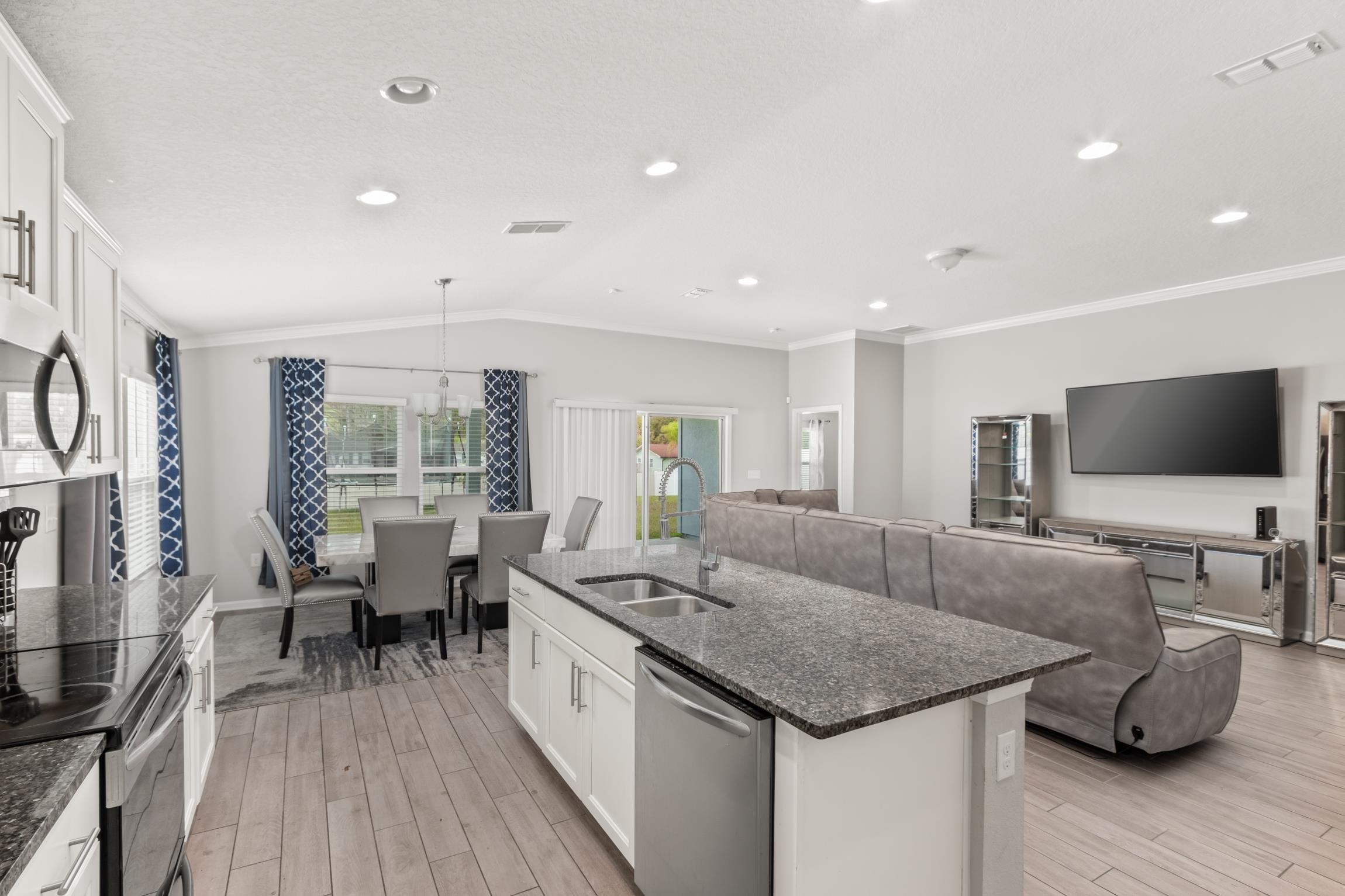 392 South Hamilton Springs Road St. Augustine, FL 32084 - Photo 11 of 29 a living room with furniture and a flat screen tv