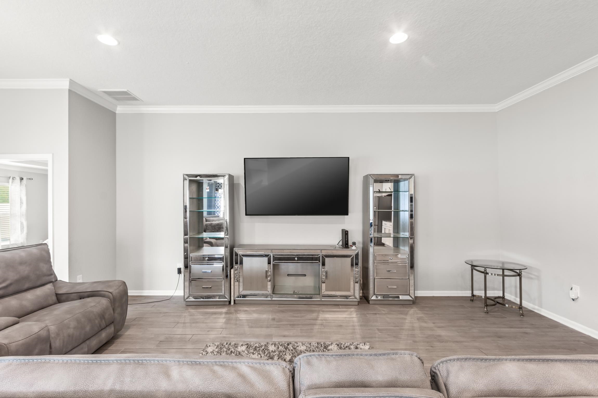 392 South Hamilton Springs Road St. Augustine, FL 32084 - Photo 13 of 29 a living room with furniture and a flat screen tv