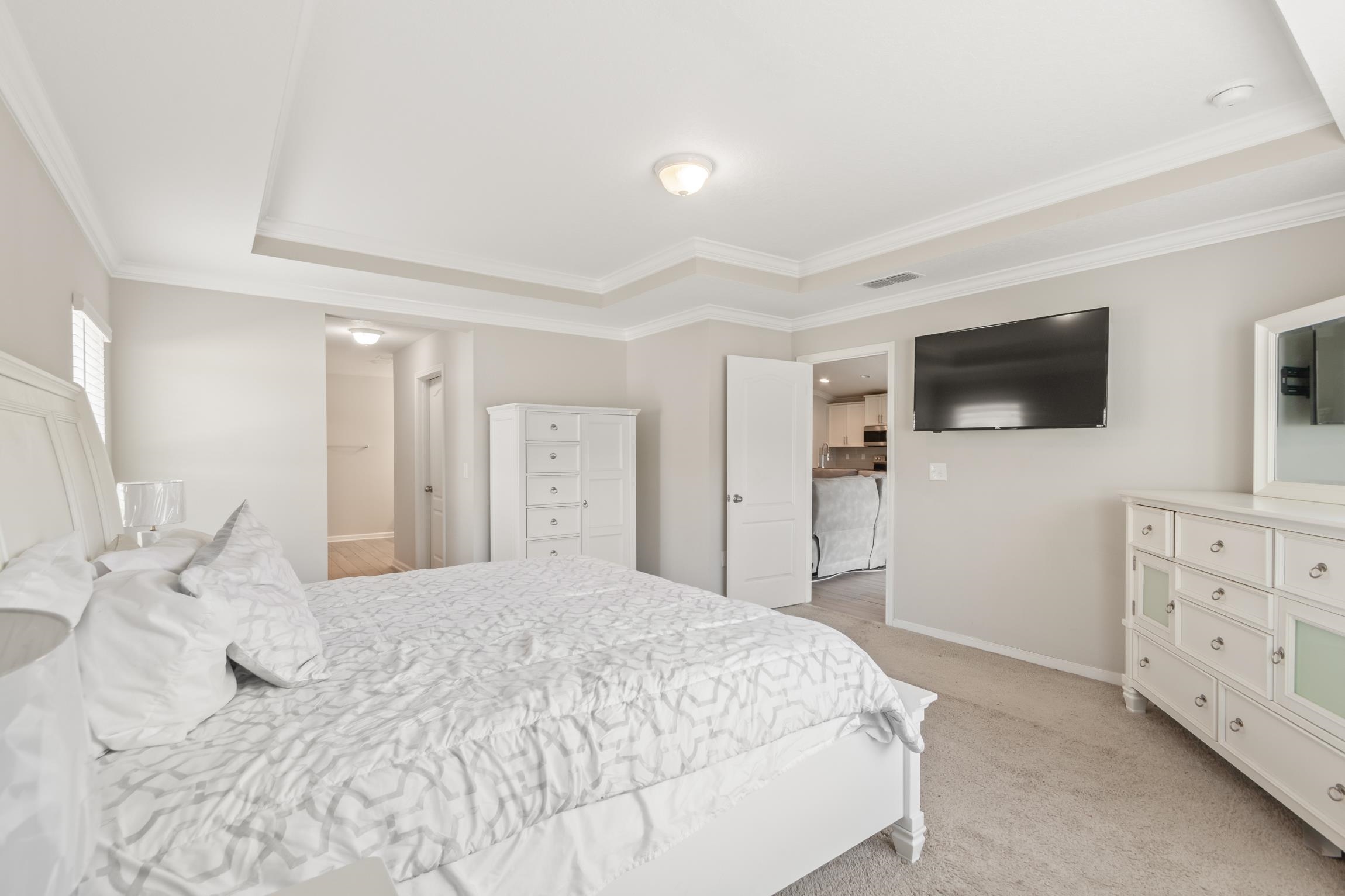 392 South Hamilton Springs Road St. Augustine, FL 32084 - Photo 14 of 29 a bedroom with a bed and a flat screen tv