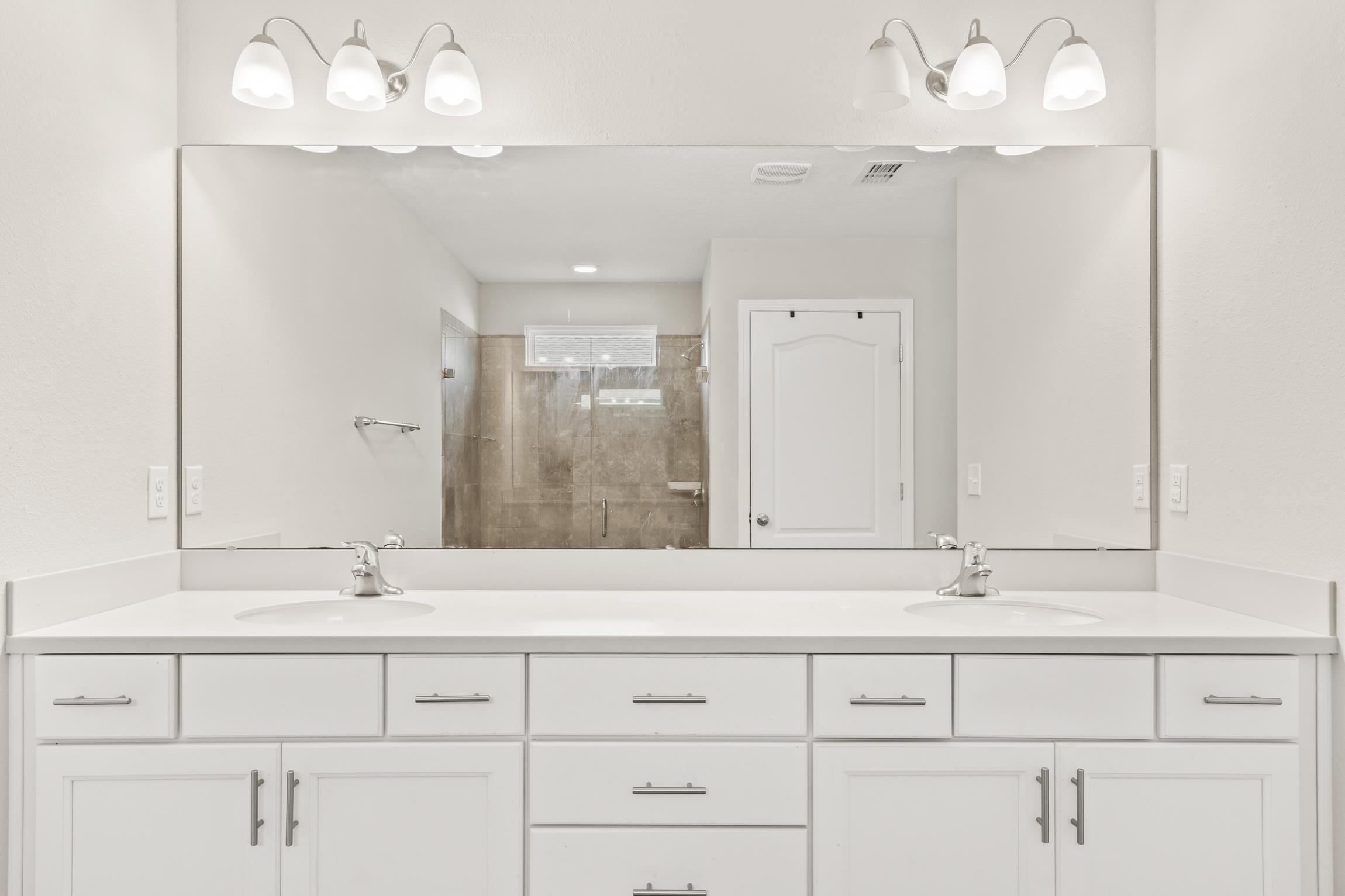 392 South Hamilton Springs Road St. Augustine, FL 32084 - Photo 18 of 29 a bathroom with a sink mirror and vanity