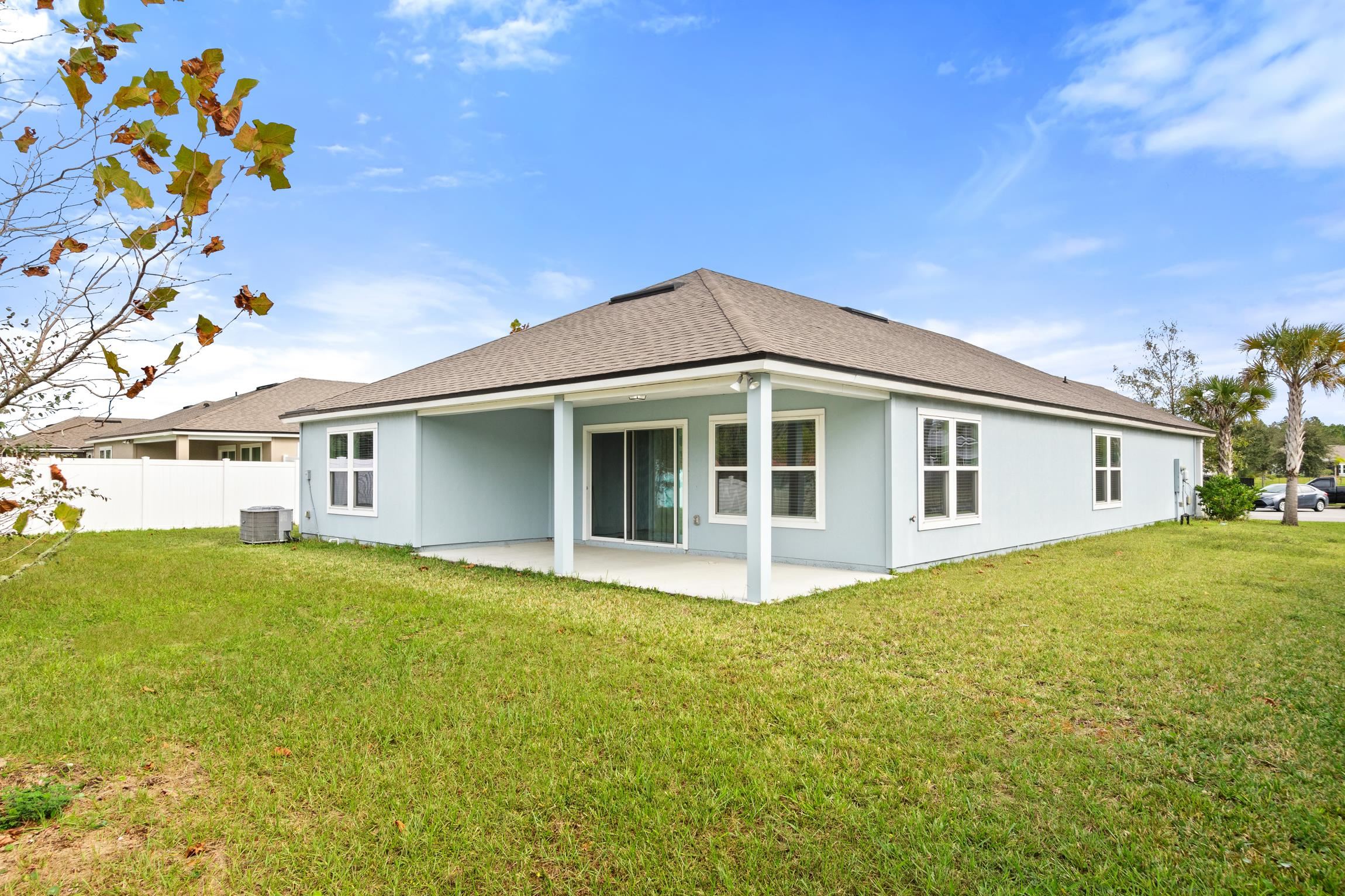 392 South Hamilton Springs Road St. Augustine, FL 32084 - Photo 27 of 29 a front view of a house with a garden