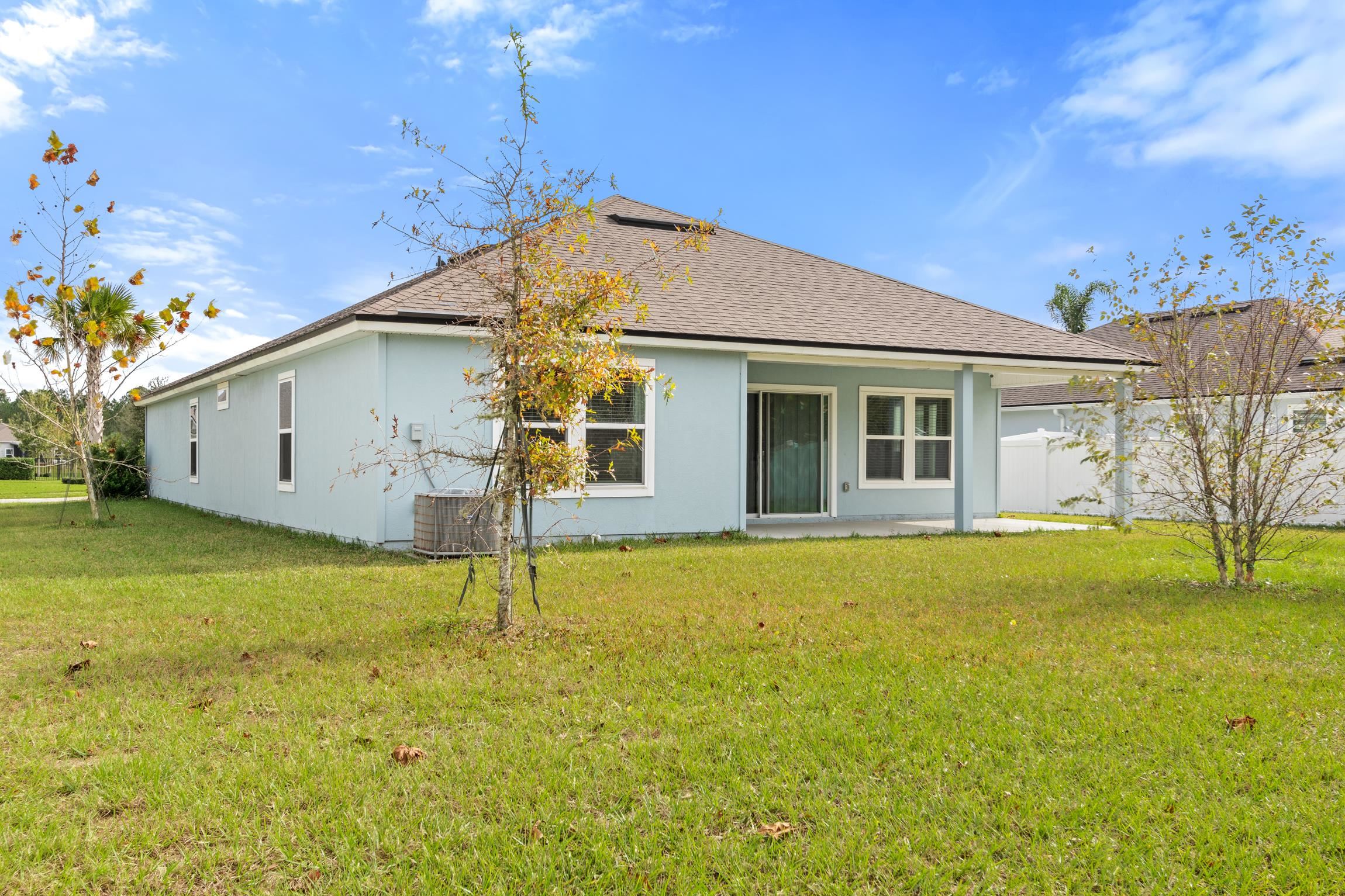 392 South Hamilton Springs Road St. Augustine, FL 32084 - Photo 29 of 29 a house with swimming pool in front of it